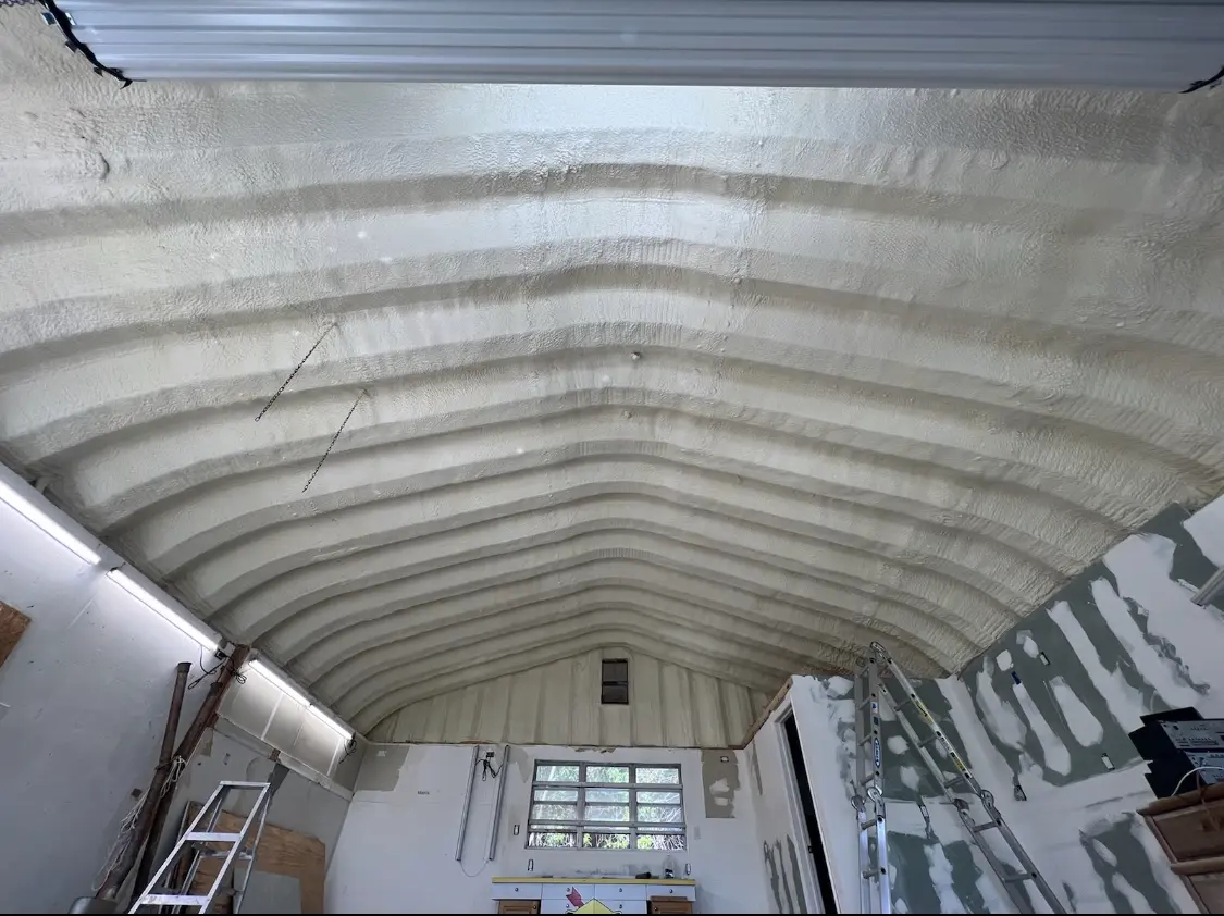 Spray polyurethane foam applied to the underside of a metal roof deck in Oshtemo